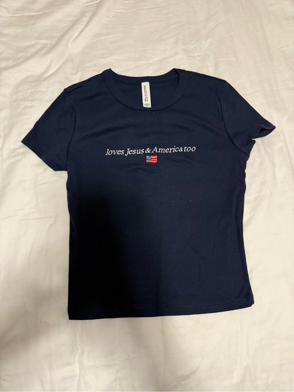 Bella Canvas Navy Short Sleeve Tee with White Script & Small Flag Graphic